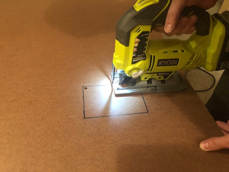 Use a Ryobi Jigsaw to cut out precise cuts for the outlet and vent covers. 