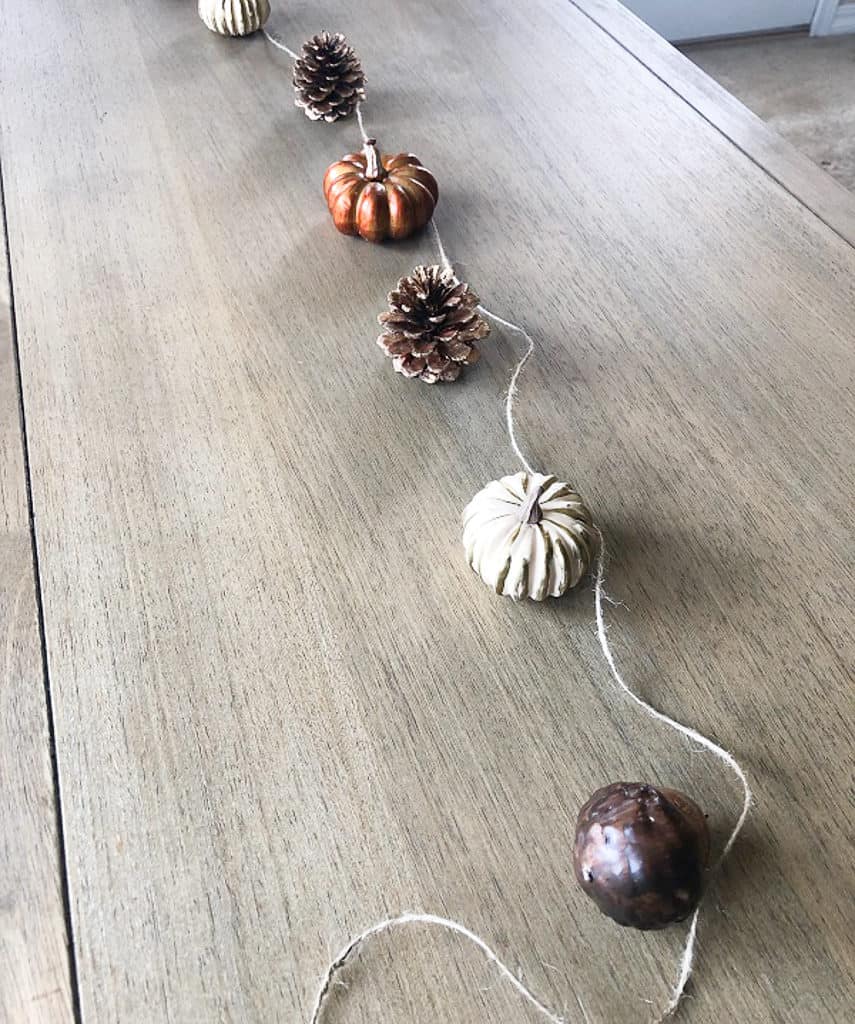 Measure and plan out your design for your DIY fall garland before gluing it together. 