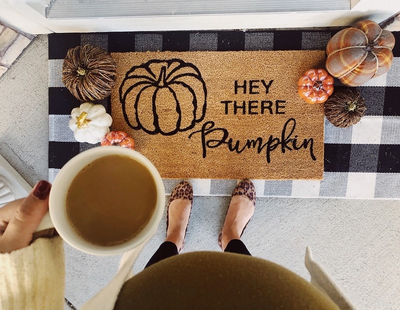 Try a layered rug for your fall front porch. 