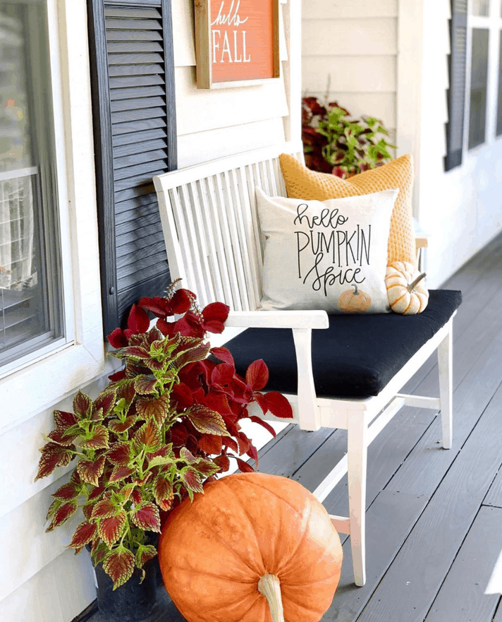Add fall pillows to your front porch bench to decorate for fall. 