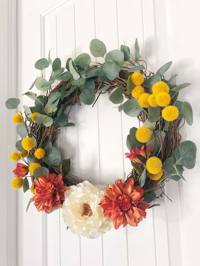 Fall grapevine wreath tutorial using hobby lobby eucalyptus, grapevine wreath and flowers. 