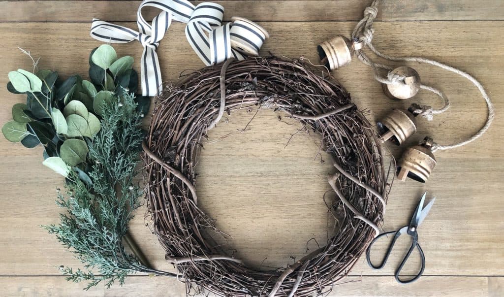 Materials for DIY Christmas Wreath with Ribbon and Brass Bells. 
