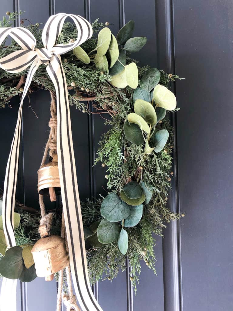 Hang your bells first and then your Christmas wreath over it when it is finished. 