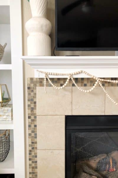 DIY Wood Bead Garland Tutorial to hang on your fireplace mantel.