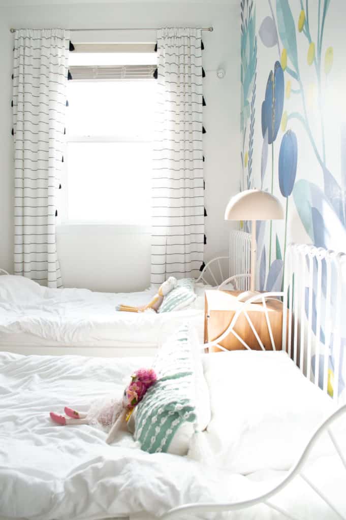 Olivia and Juliana's shared big girl bedroom reveal. Check out the details on this happy and floral sister bedroom every little girl would love. 