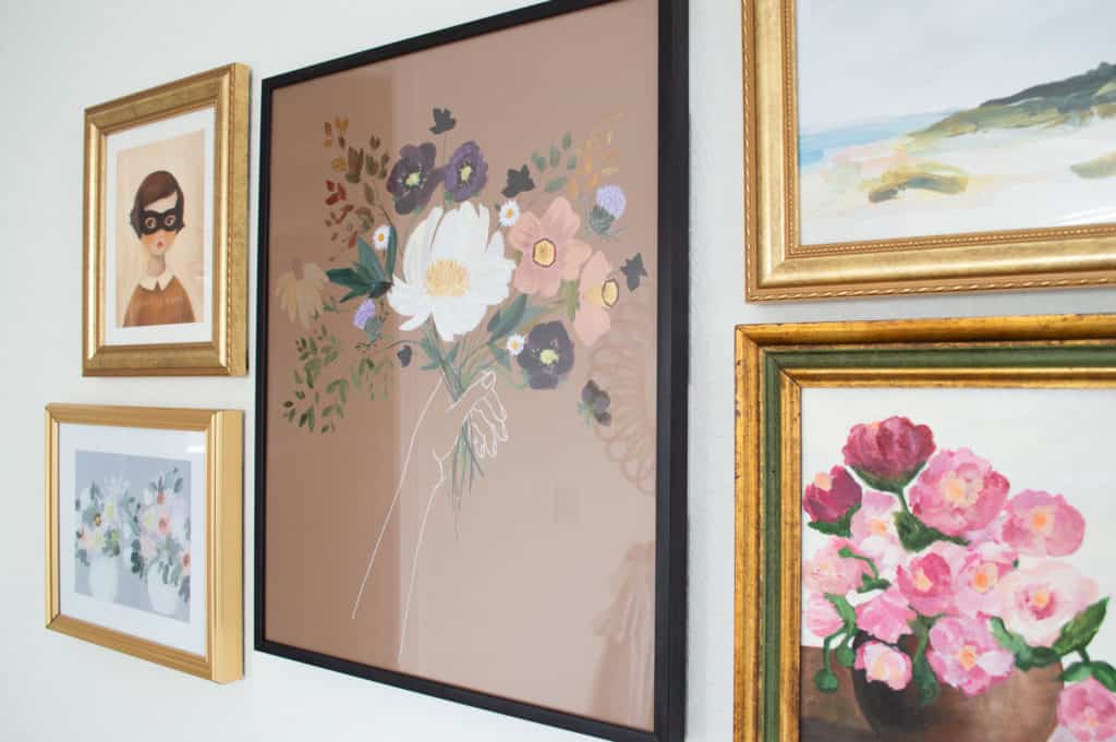 Art gallery wall for a happy and floral girls bedroom. 