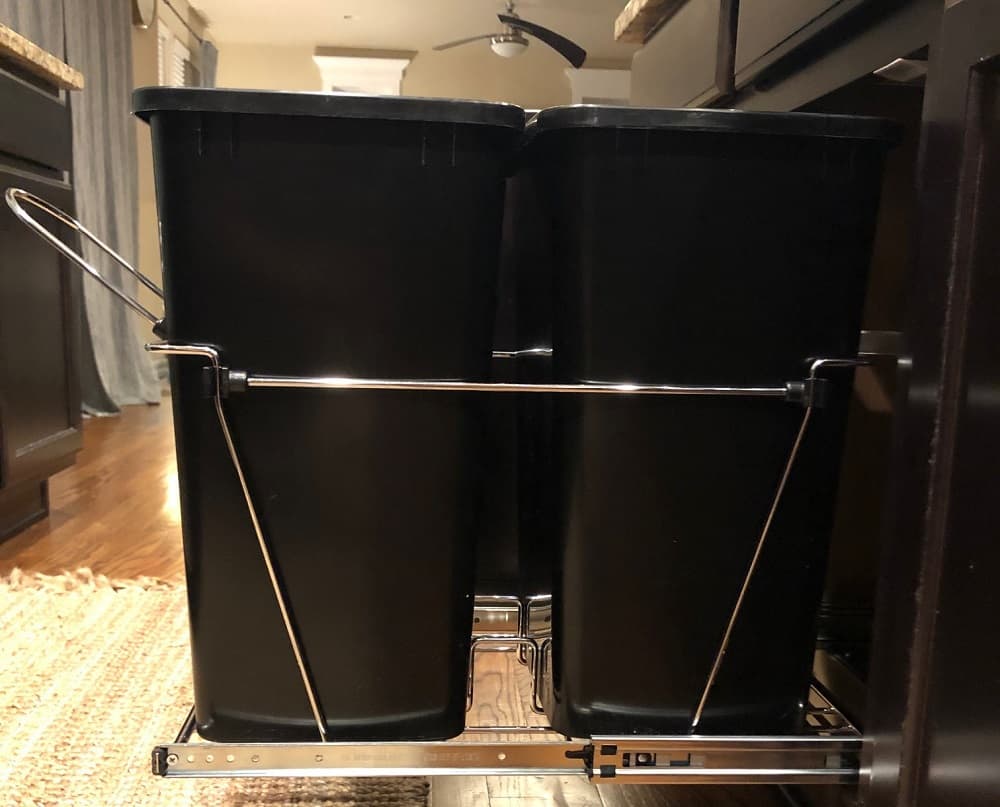 The Rev A Shelf pull out trash container allows you to put your trash can conveniently in your kitchen cabinet. It is super easy to install too! 