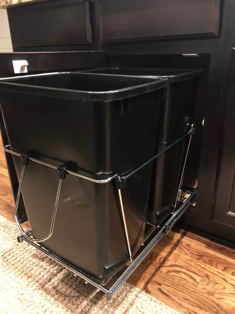 The Rev A Shelf is the perfect solution if you want to put your kitchen trash cans in a cabinet. 