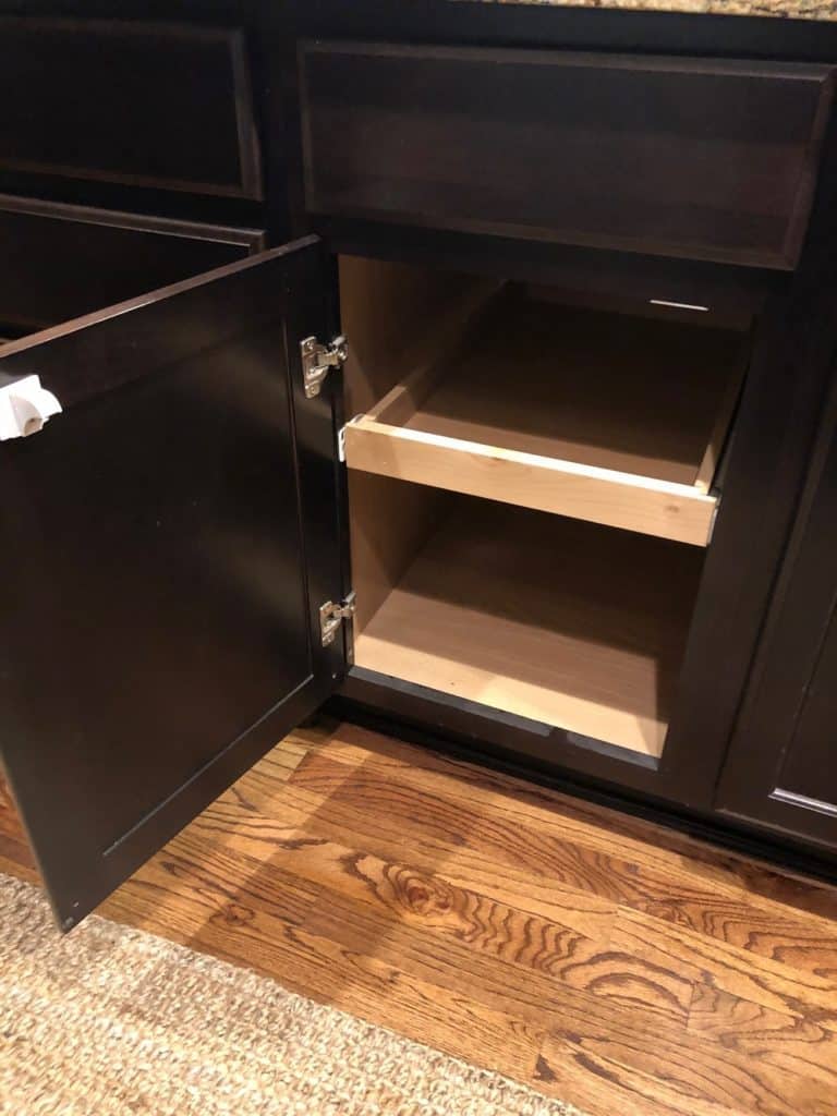 We decided to hide our kitchen trash can inside this cabinet. In order to do so, we had to remove this shelf. 