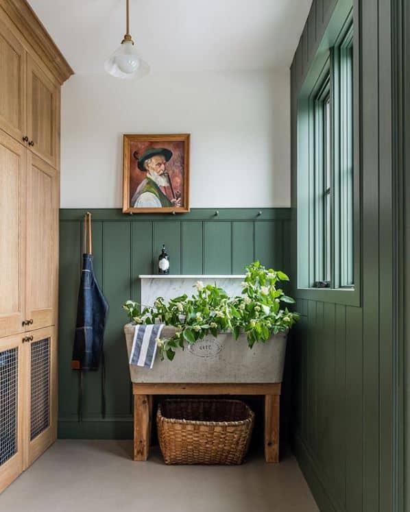 Benjamin Moore's Backwoods is painted in this beautiful mudroom by Building Walnut Farm. 